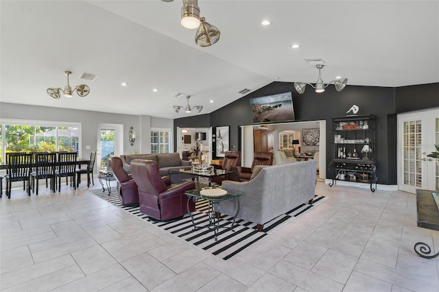 living room featuring high vaulted ceiling, a notable chandelier, and light tile patterned floors