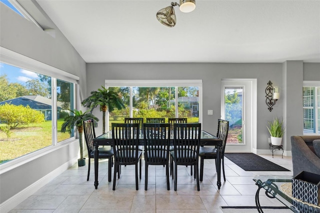 dining space featuring a healthy amount of sunlight and light tile patterned flooring