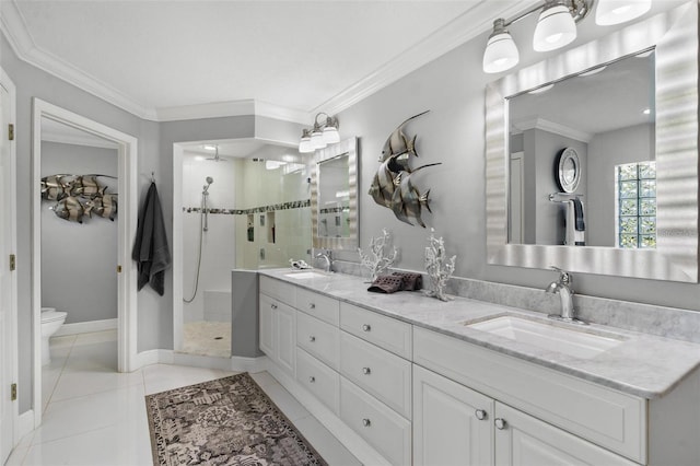 bathroom with a tile shower, toilet, ornamental molding, and vanity