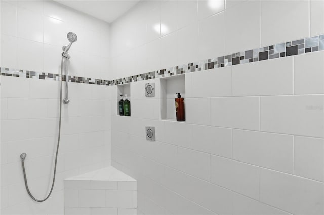 bathroom with a tile shower