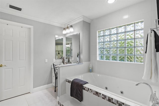 bathroom with vanity, crown molding, a relaxing tiled tub, and tile patterned floors