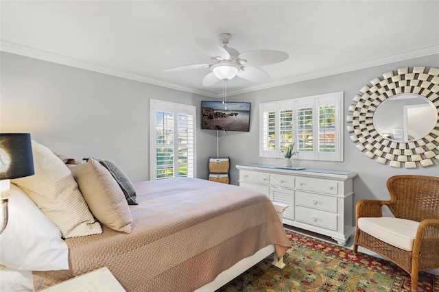 bedroom featuring crown molding, multiple windows, and ceiling fan