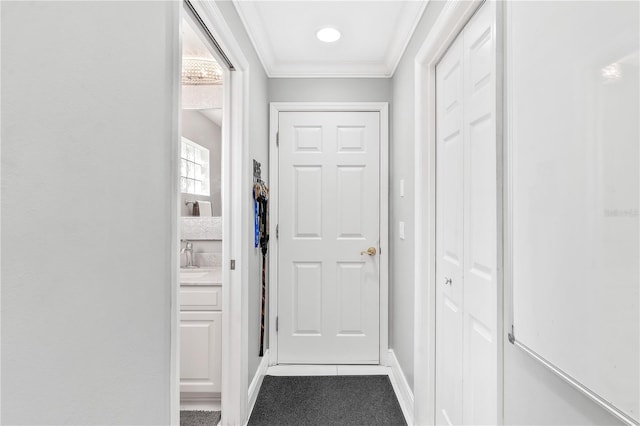 hall featuring crown molding and carpet floors