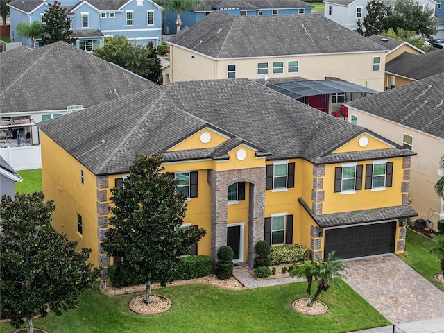 view of front facade featuring a garage and a front yard