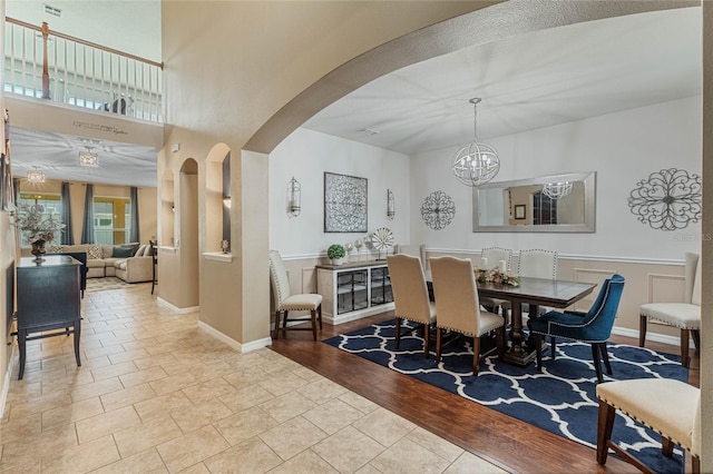 dining space with an inviting chandelier and light wood-type flooring