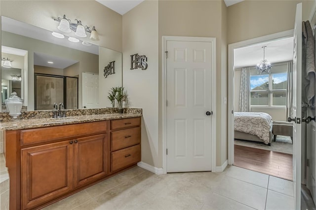 349 Morning View Dr, Winter Garden, FL 34787 - bathroom with ensuite bath, vanity, a shower stall, a chandelier, and tile patterned flooring