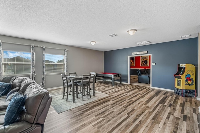 349 Morning View Dr, Winter Garden, FL 34787 - dining room with wood finished floors and a textured ceiling