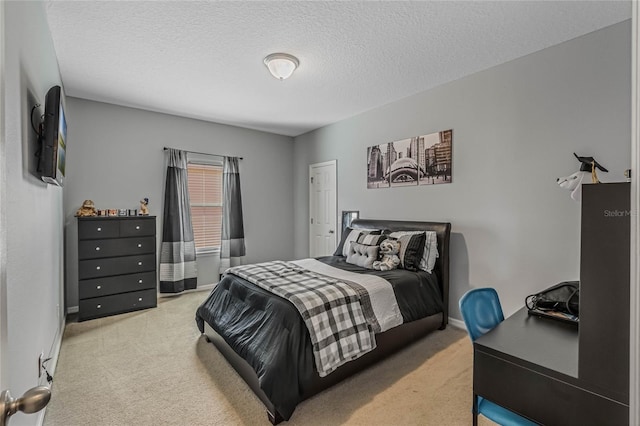 bedroom with carpet flooring and a textured ceiling