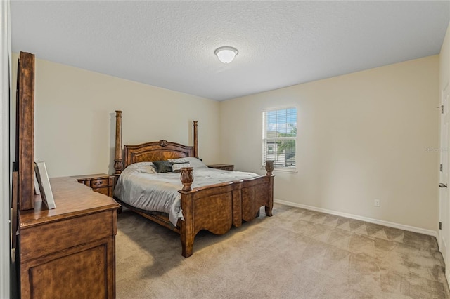 carpeted bedroom with a textured ceiling