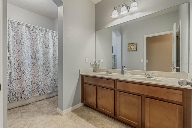 bathroom with vanity and tile patterned flooring