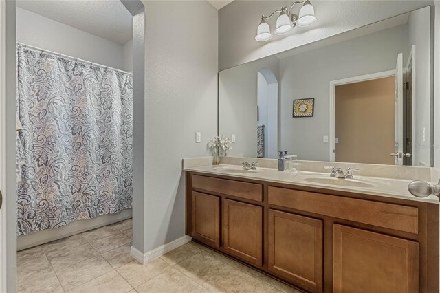 349 Morning View Dr, Winter Garden, FL 34787 - bathroom featuring double vanity, tile patterned flooring, and curtained shower