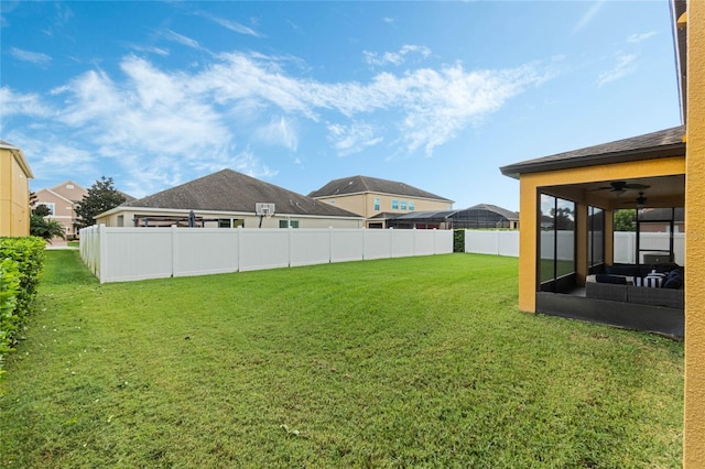 view of yard with ceiling fan