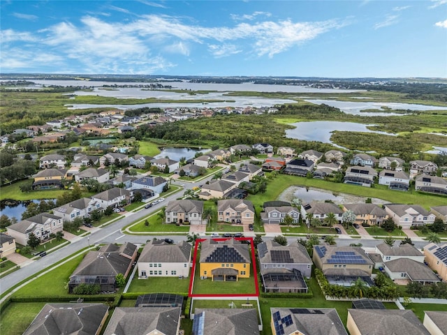 birds eye view of property featuring a water view