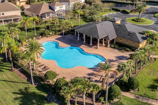 view of swimming pool with a yard and a patio