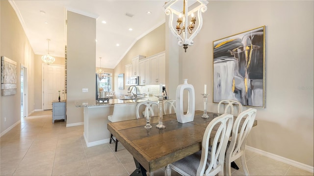 dining area featuring crown molding, light tile patterned flooring, and high vaulted ceiling