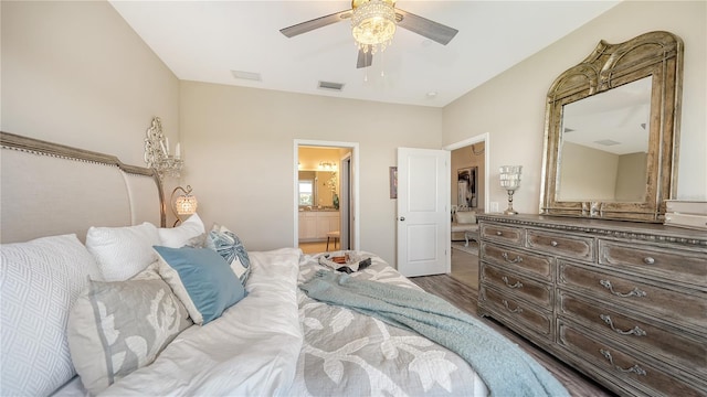 bedroom with dark hardwood / wood-style flooring, connected bathroom, and ceiling fan