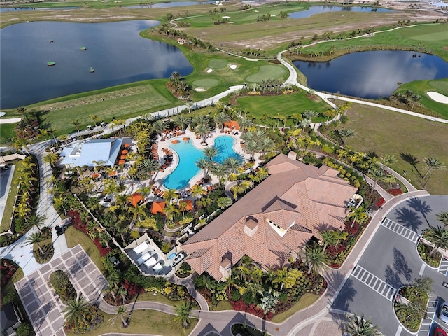 bird's eye view with a water view and view of golf course