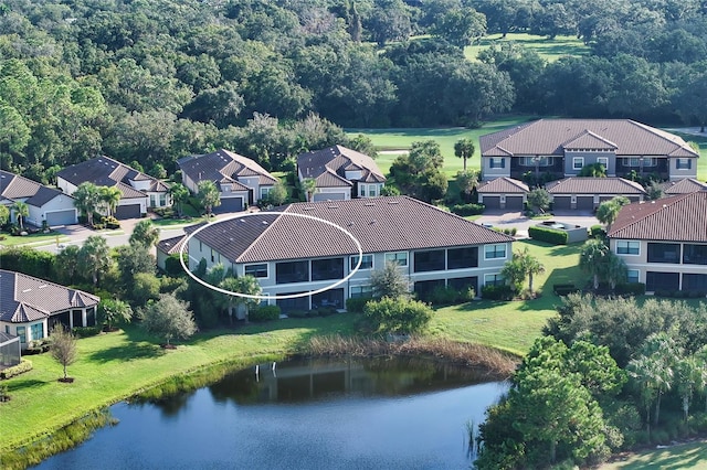 drone / aerial view with a water view