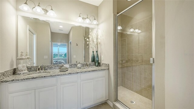 bathroom featuring vanity and walk in shower