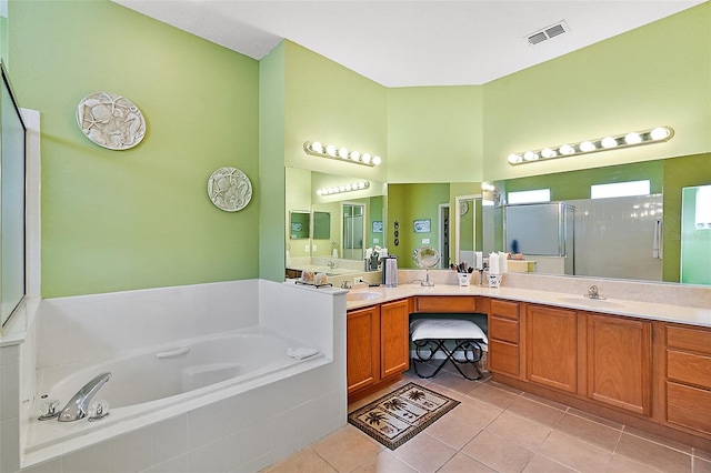 bathroom with vanity, shower with separate bathtub, and tile patterned flooring