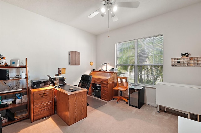 carpeted home office with ceiling fan