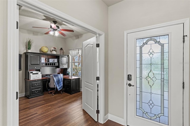 entrance foyer featuring ceiling fan and dark wood-type flooring