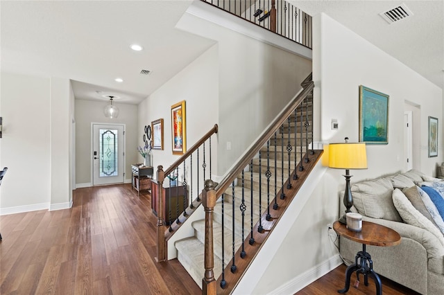 entryway with dark wood-type flooring