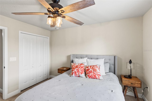 bedroom featuring ceiling fan and a closet