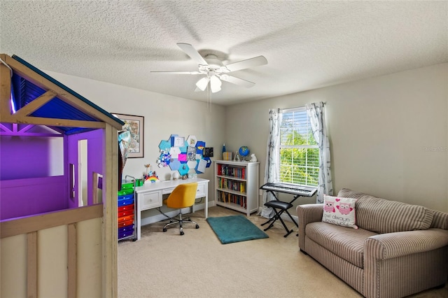 office space featuring a textured ceiling, carpet floors, and ceiling fan