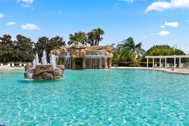 view of pool featuring pool water feature