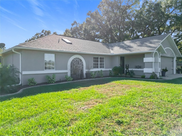 ranch-style house with a garage and a front lawn