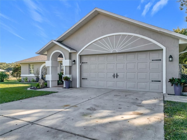 view of front facade with a front yard and a garage