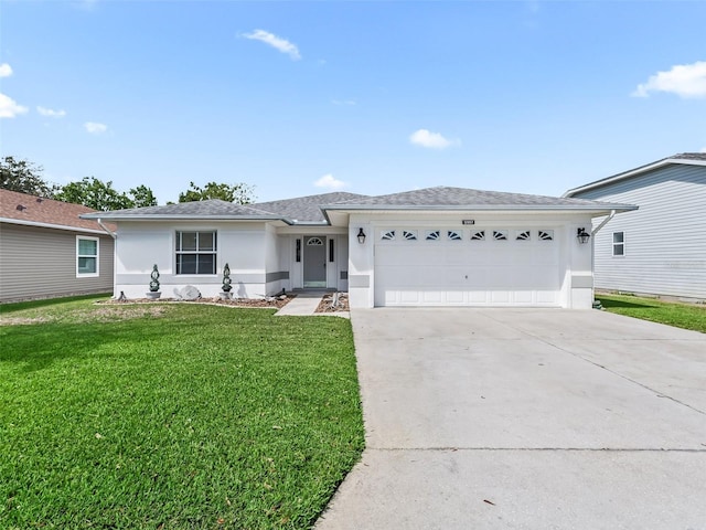 single story home featuring a garage and a front yard