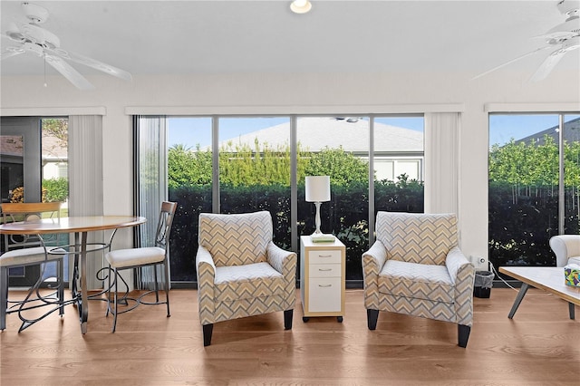 sunroom / solarium with a wealth of natural light and ceiling fan