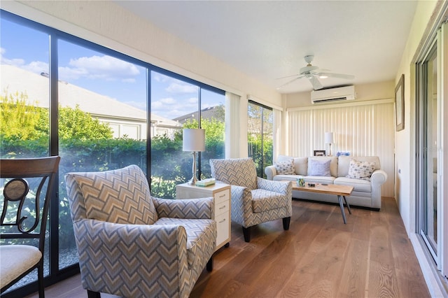 sunroom featuring an AC wall unit and ceiling fan