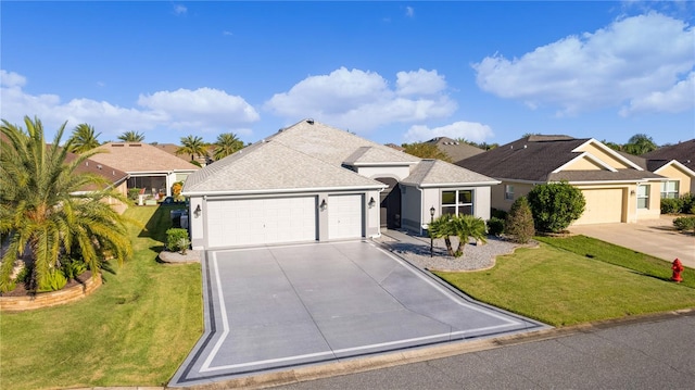 ranch-style house featuring a front yard and a garage