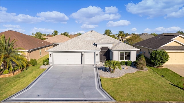 ranch-style home featuring a garage and a front lawn