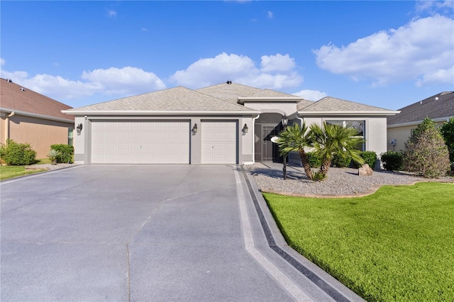 ranch-style home featuring a garage and a front lawn