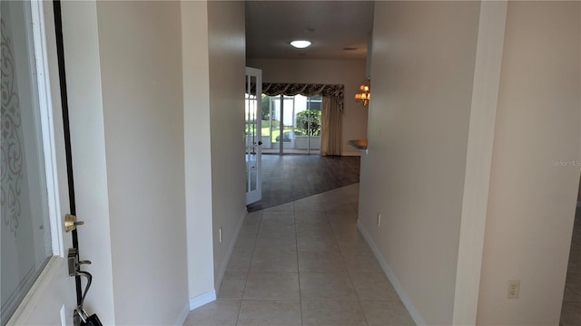 hallway with light tile patterned floors