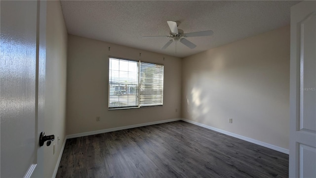 spare room with ceiling fan, dark hardwood / wood-style flooring, and a textured ceiling