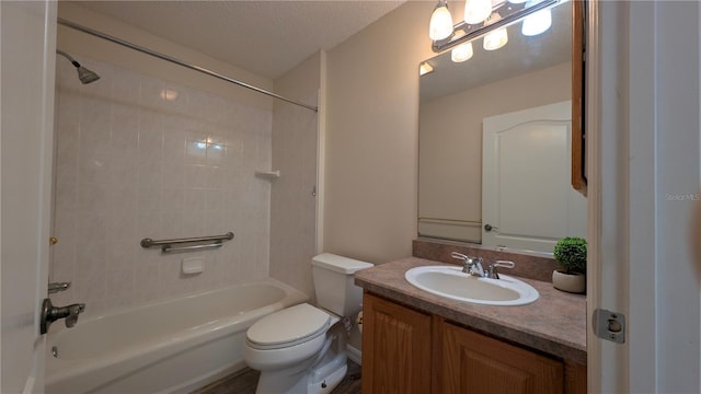 full bathroom with vanity, a textured ceiling, tiled shower / bath combo, and toilet