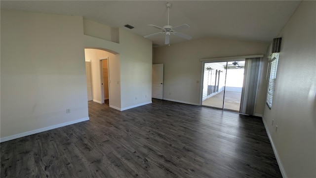 empty room with dark hardwood / wood-style floors, vaulted ceiling, and ceiling fan