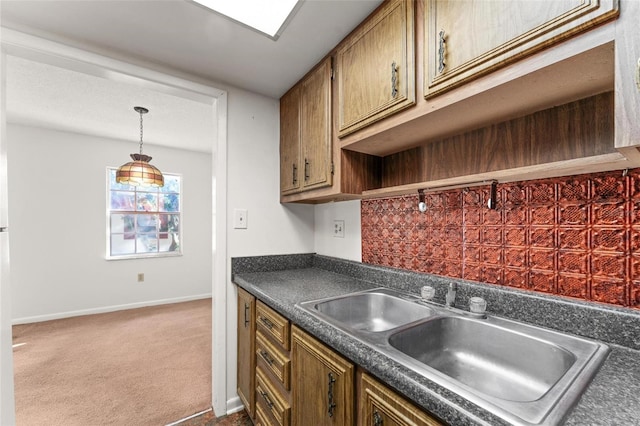 kitchen with sink and carpet floors