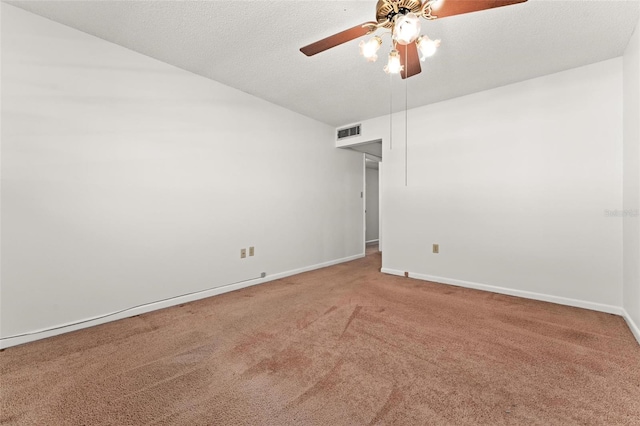 empty room featuring carpet, a textured ceiling, and ceiling fan