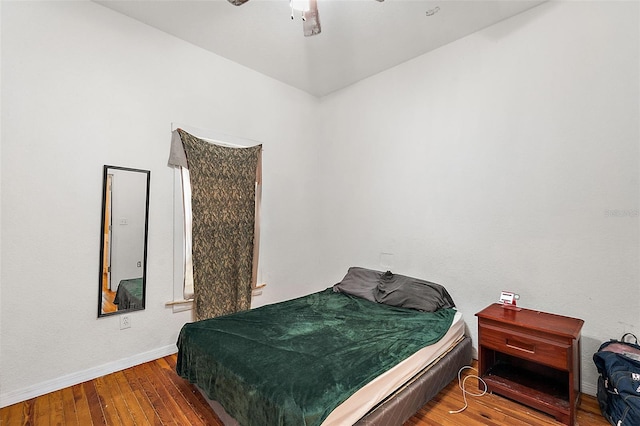 bedroom featuring hardwood / wood-style floors and ceiling fan