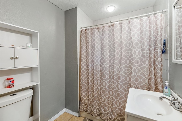 bathroom with vanity, a shower with shower curtain, a textured ceiling, and toilet