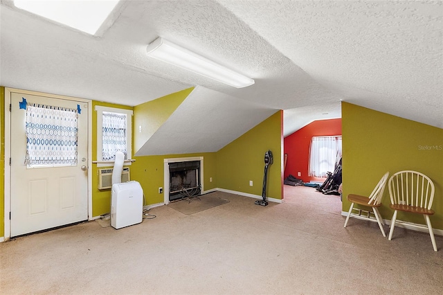 bonus room featuring cooling unit, a textured ceiling, carpet, and vaulted ceiling