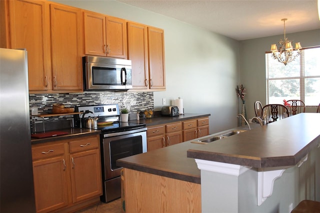 1681 Strathmore Cir, Mount Dora, FL 32757 - kitchen with appliances with stainless steel finishes, dark countertops, decorative backsplash, a chandelier, and an island with sink