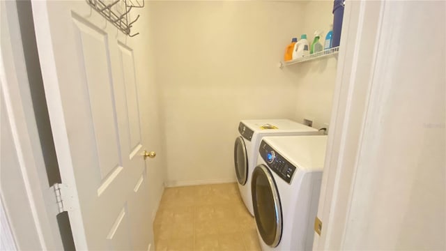 1681 Strathmore Cir, Mount Dora, FL 32757 - laundry room featuring separate washer and dryer and light tile patterned floors