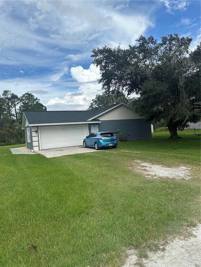 view of home's exterior featuring a garage and a yard